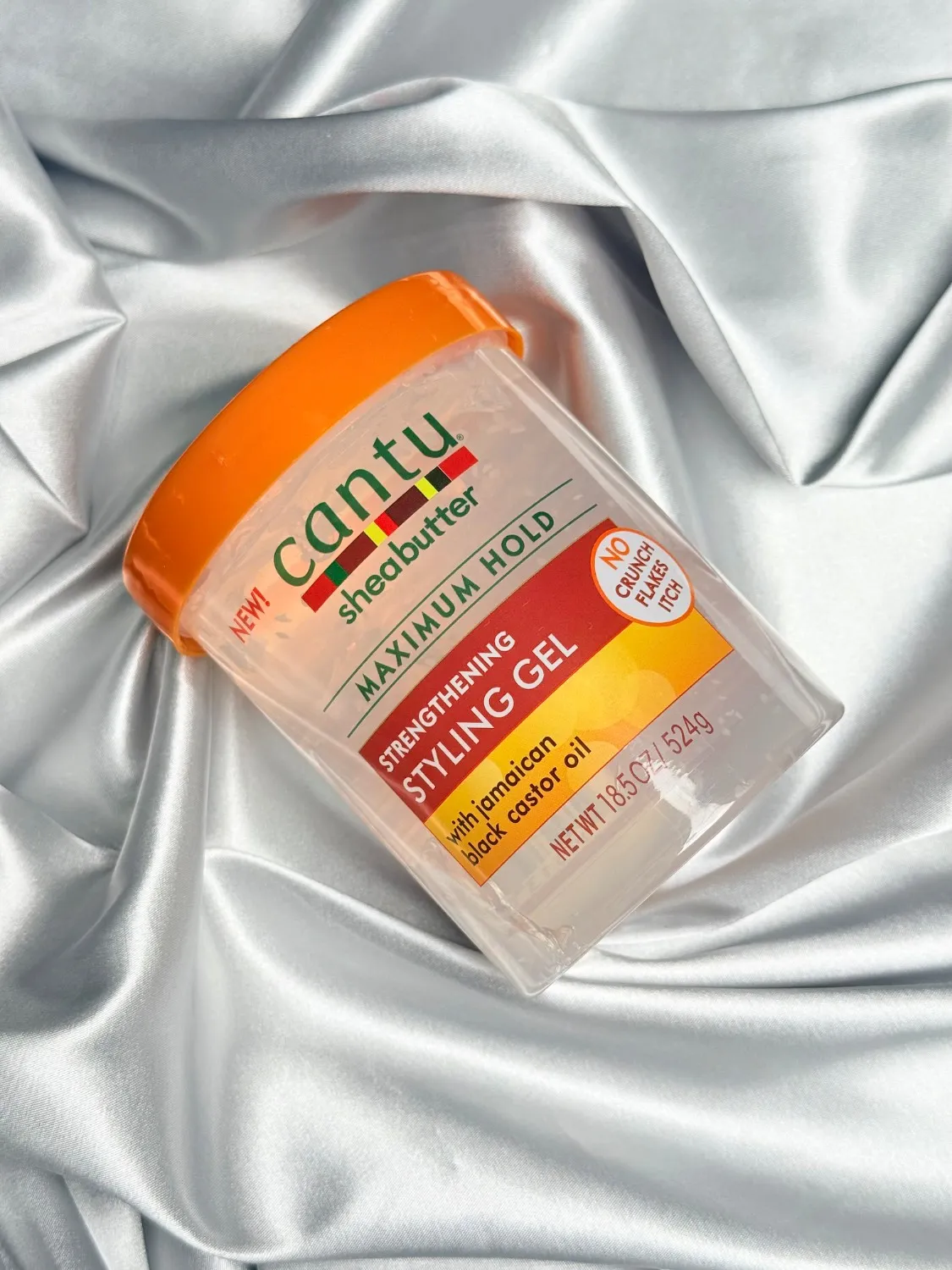 IMG_1738 کنتو ژل حالتدهنده و تقویتکننده موی فر حاوی روغن کرچک سیاه جامائیکا مدل(Cantu Shea Butter Strengthening Styling Gel with Jamaican Black Castor Oil – Maximum Hold)حجم۵۲۴ میلی گرم - تصویر 1
